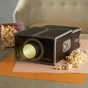 Project your smartphone videos onto the big screen with the 8x magnifying, portable and easy to assemble universal smartphone projector. Lightweight and compact the projector can be taken anywhere and stored conveniently when not in use.